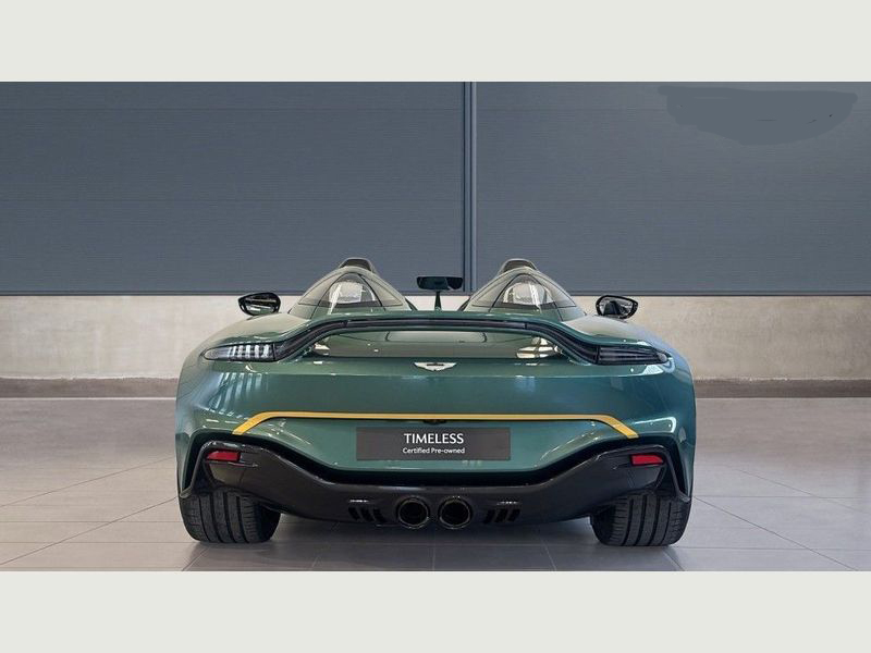 A silver Aston Martin V12 parked, highlighting its rental appeal