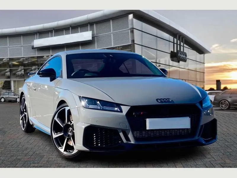 Rear view of the Audi TT RS, highlighting its sporty exhaust and spoiler for hire