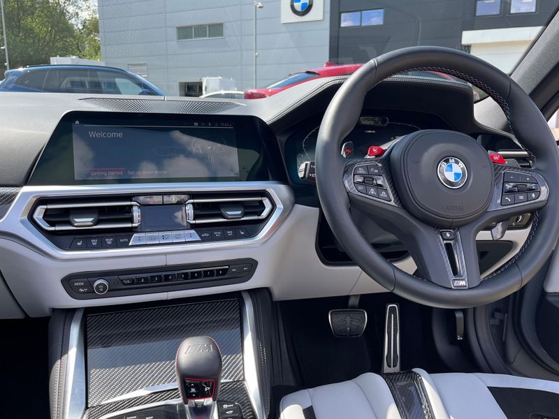 A line-up of BMW M4 series cars ready for rental