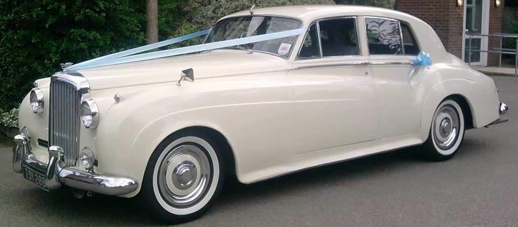 The Bentley S1 from 1956 available for hire, shown in a classic setting.