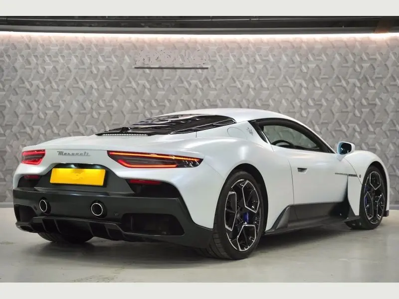 A white Maserati MC20 showcasing its luxury car hire appeal.