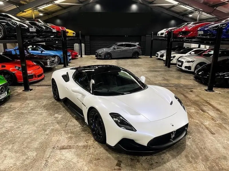 A stunning white Maserati MC20 available for sports car hire.