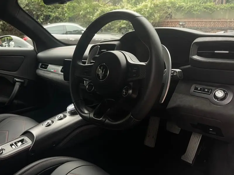 Dynamic shot of a Maserati MC20, perfect for sportscar renting.